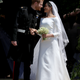 Prince Harry, Duke of Sussex and The Duchess of Sussex share a kiss after their wedding at St George’s Chapel at Windsor Castle on May 19, 2018 in Windsor, England.